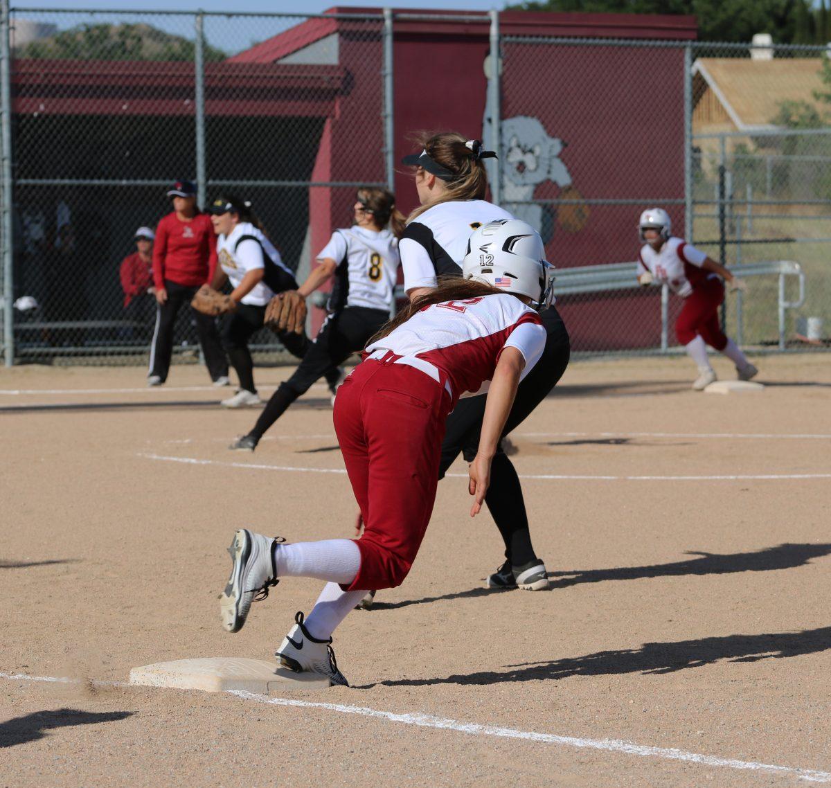 Sahara Harvey leads off to steal second base.