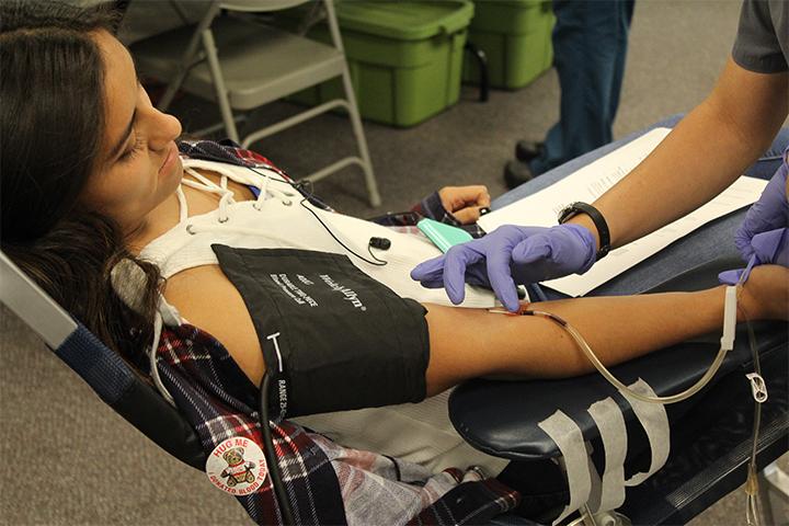 Rosa Escobar (12) begins the process of extracting red blood cells which takes about thirty minutes. 