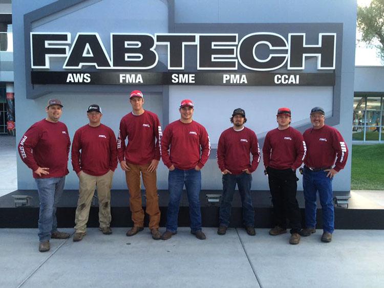 Welding team with coaches Justin Pickard and Ron Alves.
