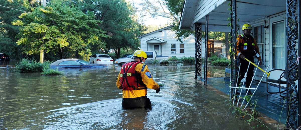 AFTER MATH: rescuers help victims get to saftey.