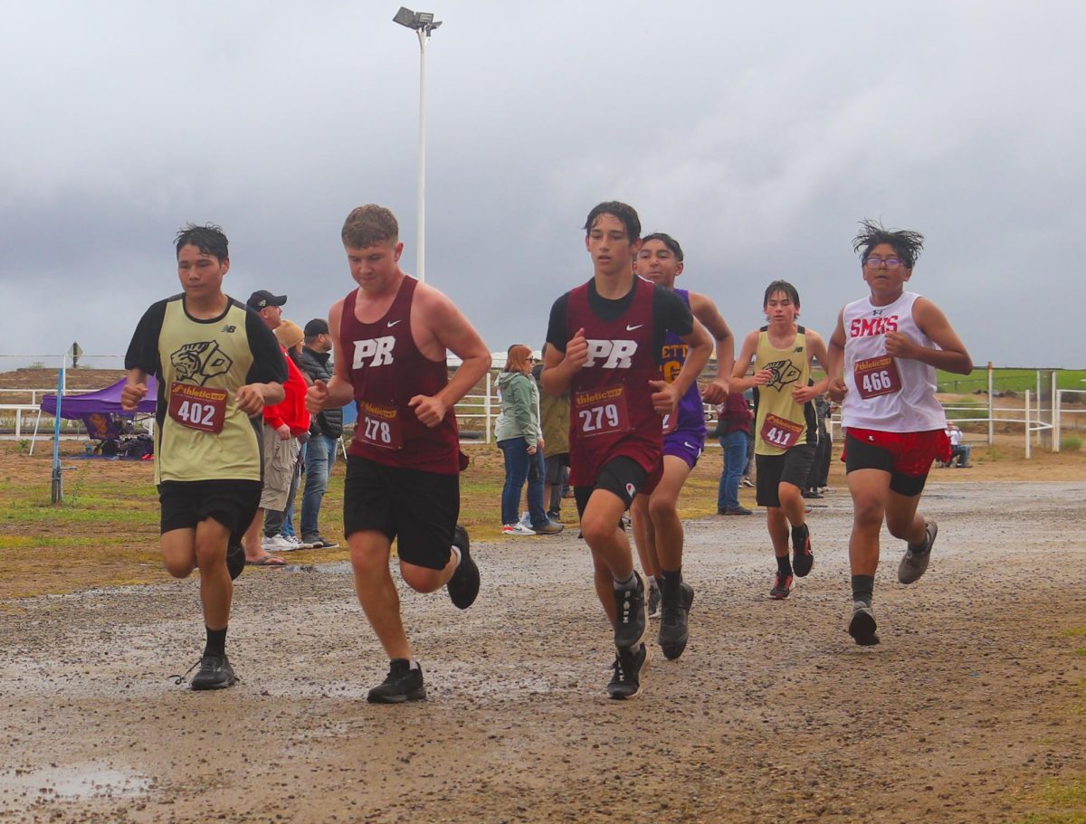 Jackson Quealy (left) and Gavin Sanchez running side by side.