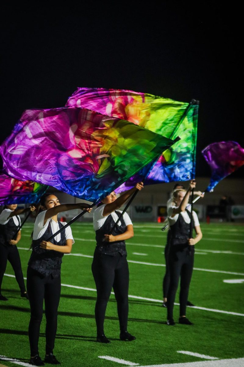 Color Guard performs during halftime to the music of the band