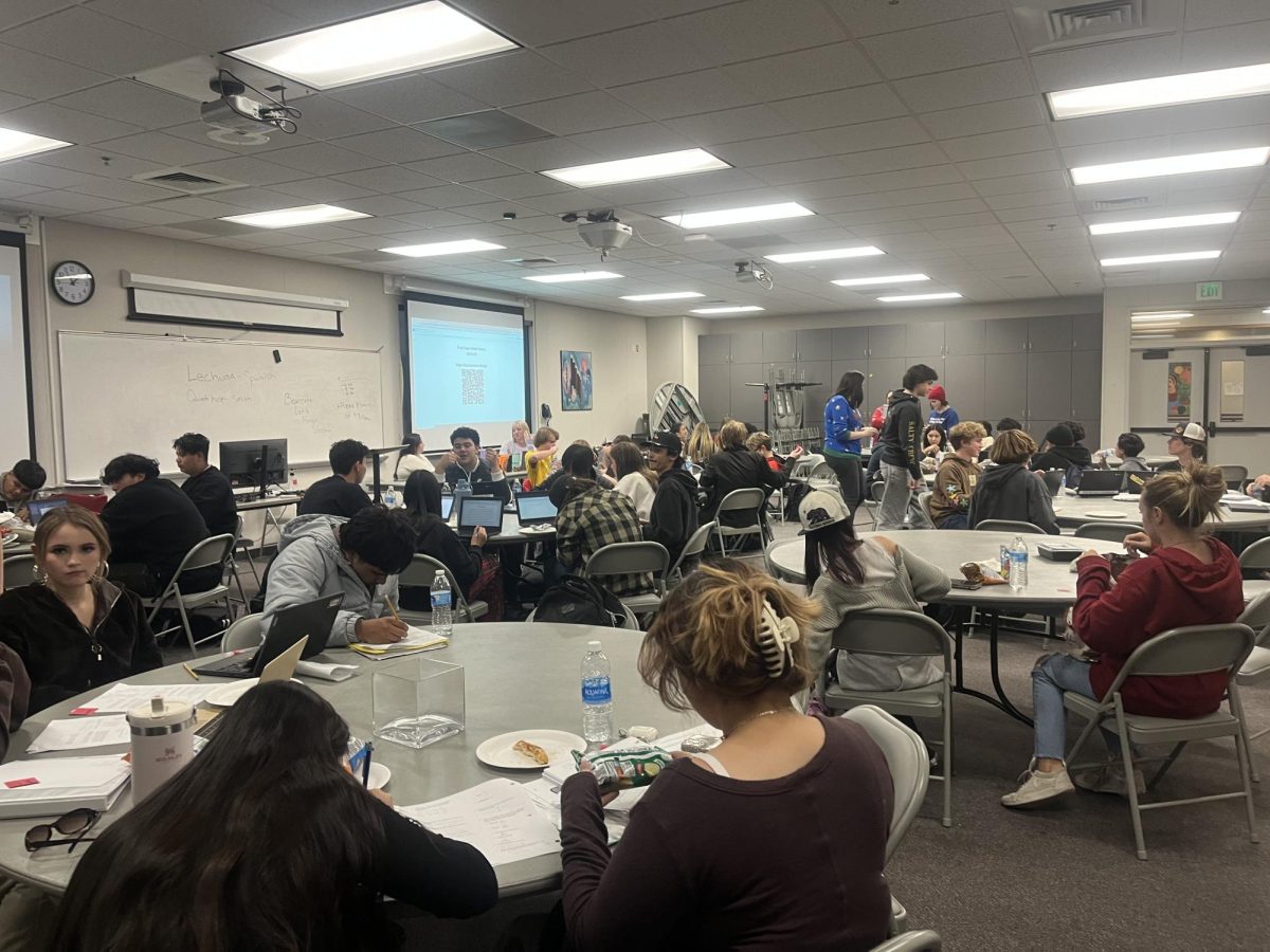 Students gather and snack at a finals study session