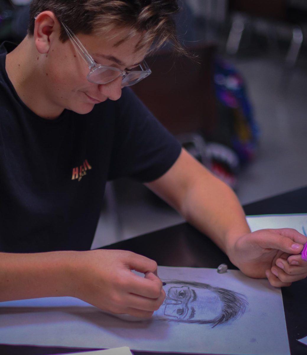 students in Mr. Brooks Art class work on self-portraits. 