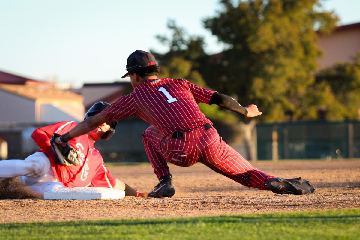 Marcus Garcia tags out a runner at third base and gains the second out of the inning