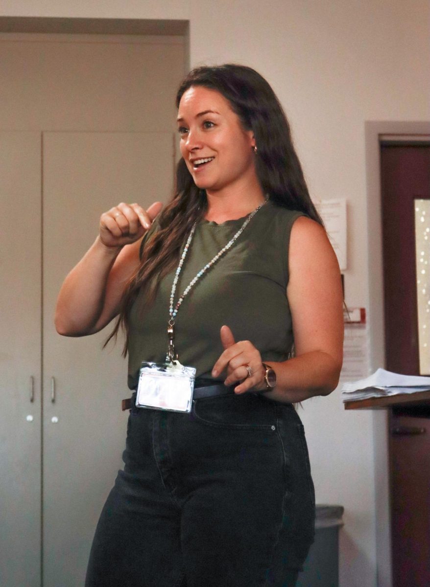 English Teacher, Morgan Couture, lectures before a timed-writing on "The Crucible"
