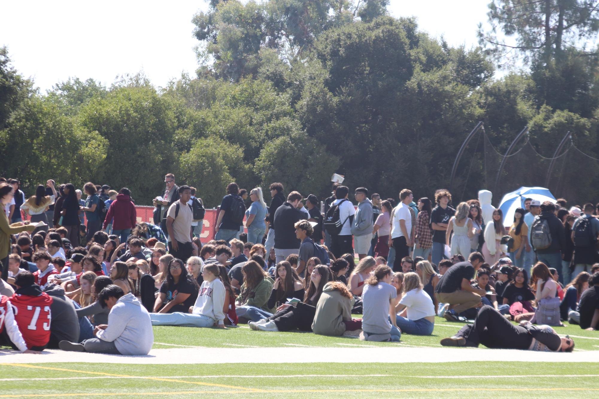 Students Sitting on the field during the fire drill on 8/29/24