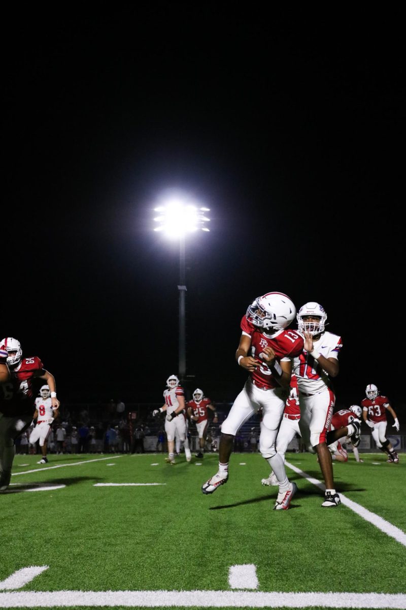 Junior Marcus Garcia (13) sending a ball down the line after seeing the perfect pass