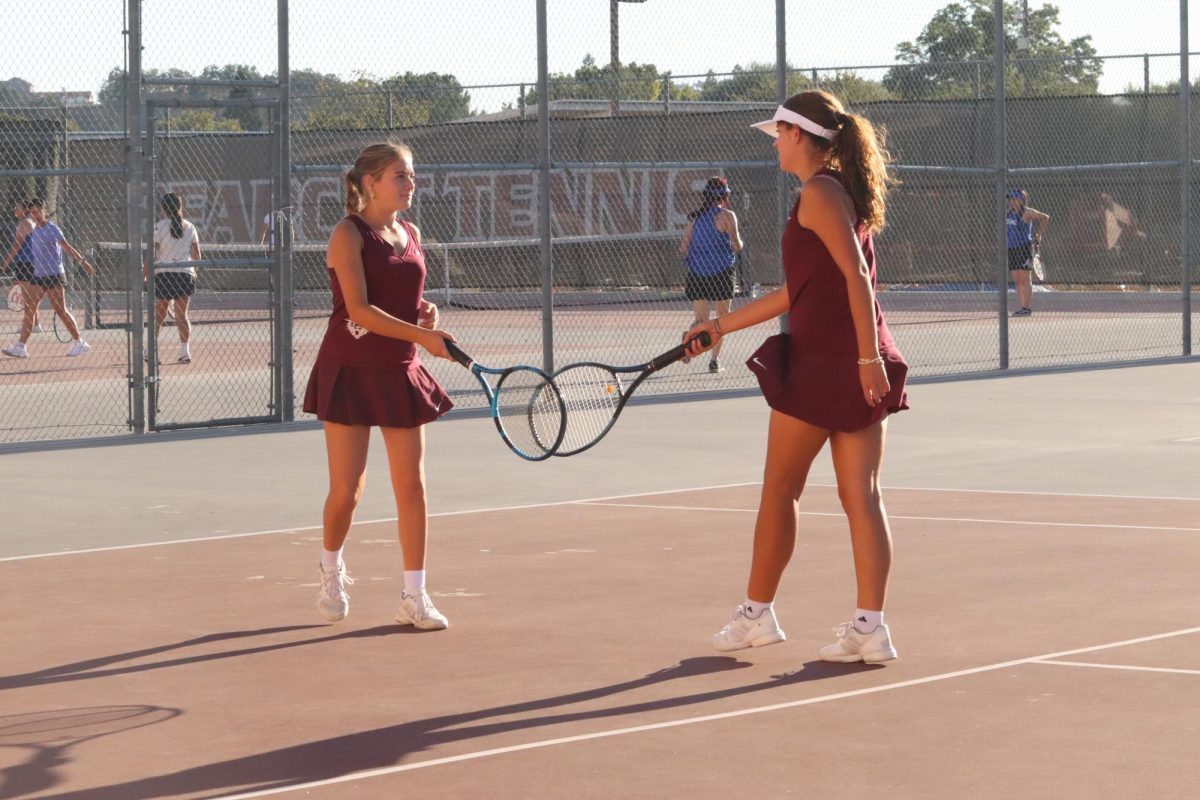 On Sept. 3, Kalia Reid and Hannah Rougeot cheer each other on during their doubles match.