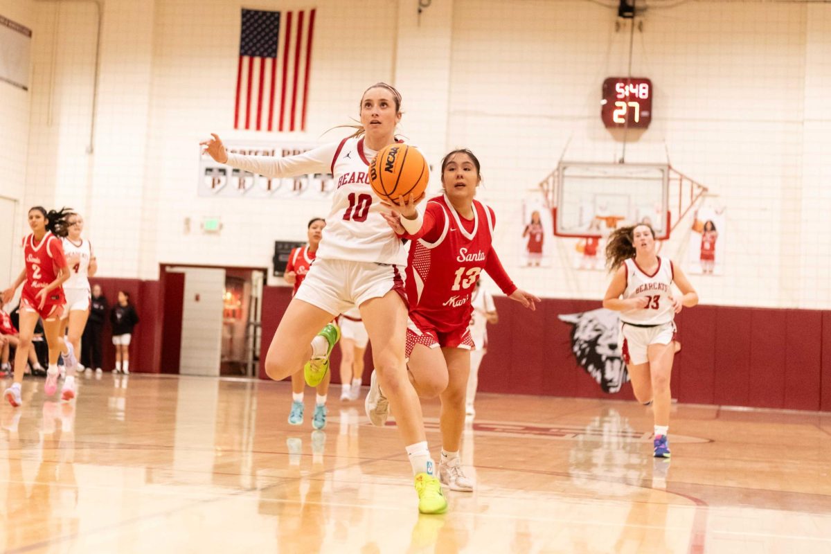 TAKEAWAY - As Santa Maria drives toward the basket, Holbrook steps in, forcing a turnover.