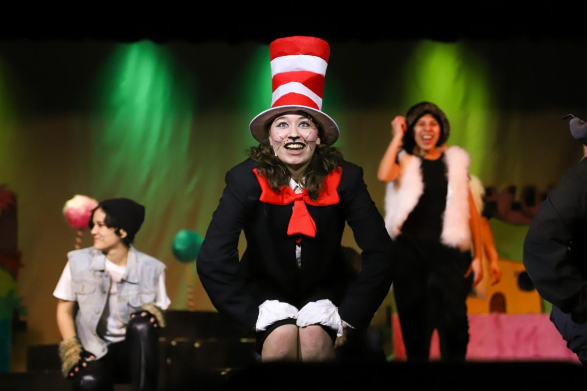 CAT IN THE HAT! - Senior Clarae Clarke narrating the story to the audience, ready to cause a bumpy ride for  Jojo and Horton.